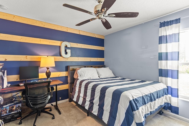 1262 SW Hunnicut Ave, Port Saint Lucie, FL 34953 - carpeted bedroom featuring a textured ceiling, a desk, ceiling fan, wooden walls, and baseboards