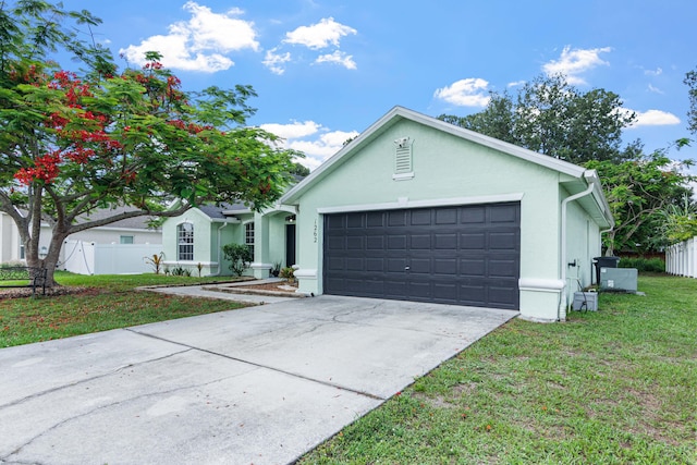 1262 SW Hunnicut Ave, Port Saint Lucie, FL 34953 - ranch-style house featuring stucco siding, an attached garage, and concrete driveway