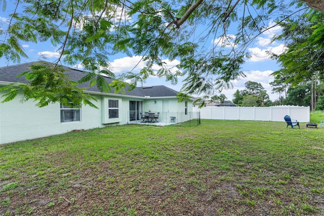1262 SW Hunnicut Ave, Port Saint Lucie, FL 34953 - view of yard featuring a patio