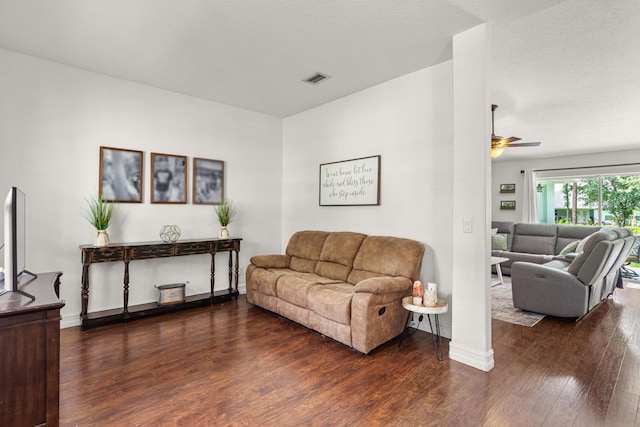 1262 SW Hunnicut Ave, Port Saint Lucie, FL 34953 - living room featuring wood finished floors, ceiling fan, and baseboards