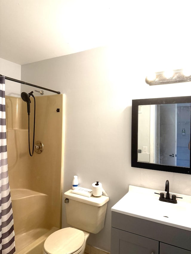 6537 SE Federal Hwy Unit 202, Stuart, FL 34997 - bathroom featuring toilet, vanity, and curtained shower
