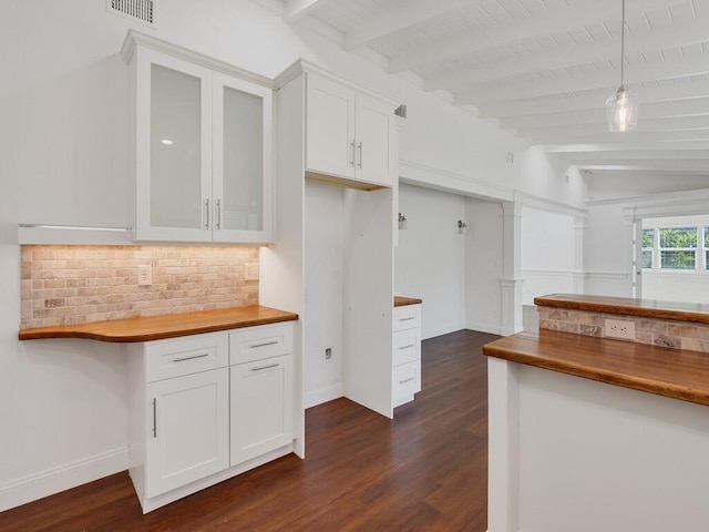 3416 Atlantic Blvd, Vero Beach, FL 32960 - kitchen with decorative backsplash, white cabinetry, butcher block counters, glass insert cabinets, and dark wood-style floors
