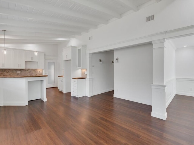 3416 Atlantic Blvd, Vero Beach, FL 32960 - unfurnished living room with beam ceiling, dark wood-style floors, and decorative columns
