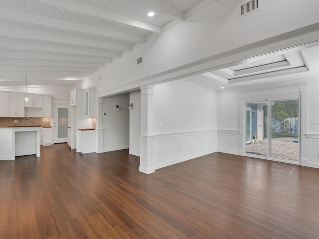 3416 Atlantic Blvd, Vero Beach, FL 32960 - unfurnished living room with beamed ceiling, dark wood-style floors, and wainscoting