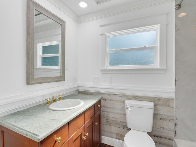 3416 Atlantic Blvd, Vero Beach, FL 32960 - bathroom featuring vanity, toilet, wainscoting, tile walls, and crown molding