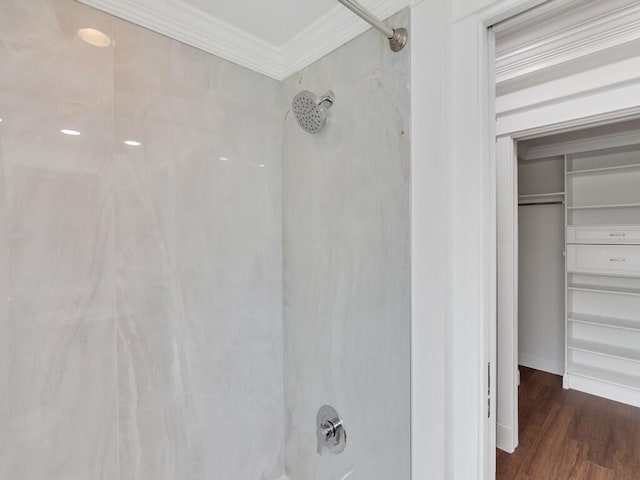 3416 Atlantic Blvd, Vero Beach, FL 32960 - bathroom featuring crown molding, wood finished floors, a spacious closet, and baseboards