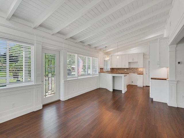 3416 Atlantic Blvd, Vero Beach, FL 32960 - unfurnished living room with dark wood-type flooring, a decorative wall, and wainscoting