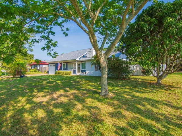 3416 Atlantic Blvd, Vero Beach, FL 32960 - view of grassy yard with an attached garage