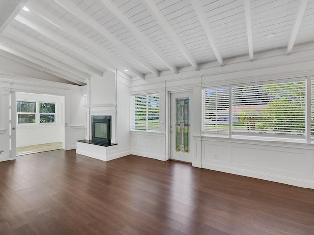 3416 Atlantic Blvd, Vero Beach, FL 32960 - unfurnished living room featuring a decorative wall, a premium fireplace, dark wood-type flooring, wooden ceiling, and wainscoting