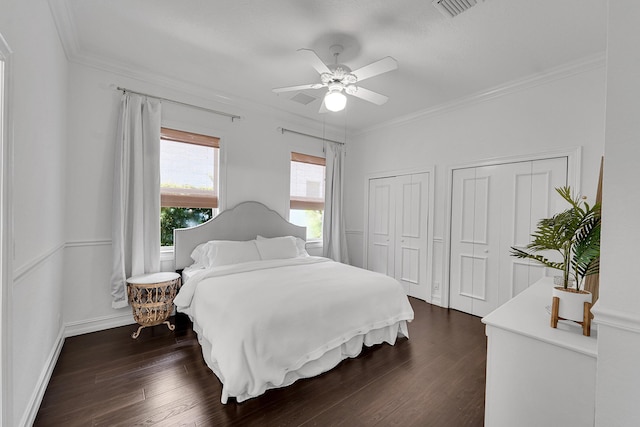 5036 NW 24th Cir, Boca Raton, FL 33431 - bedroom with multiple closets, dark wood finished floors, crown molding, ceiling fan, and baseboards