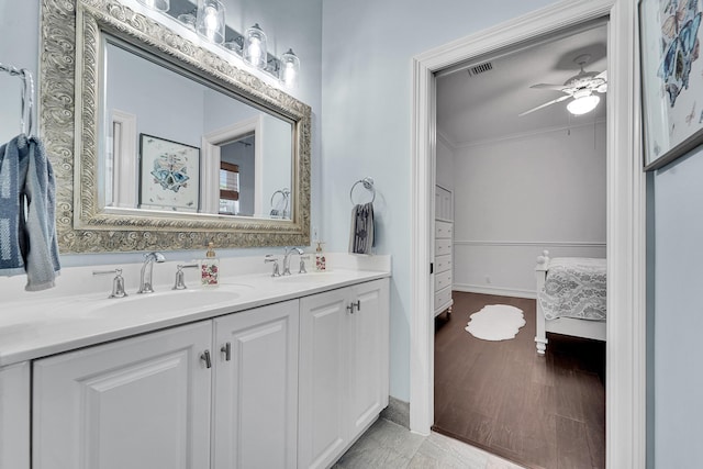 5036 NW 24th Cir, Boca Raton, FL 33431 - ensuite bathroom featuring double vanity, ceiling fan, baseboards, and ornamental molding