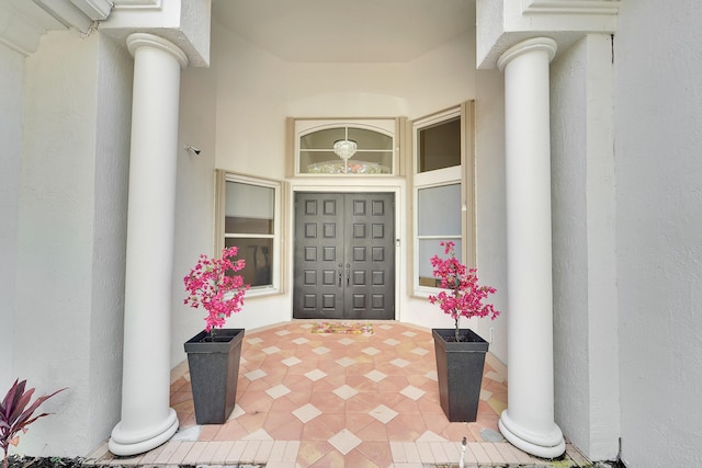 5036 NW 24th Cir, Boca Raton, FL 33431 - doorway to property featuring stucco siding and a porch