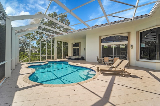 5036 NW 24th Cir, Boca Raton, FL 33431 - view of pool featuring a patio, a pool with connected hot tub, and glass enclosure