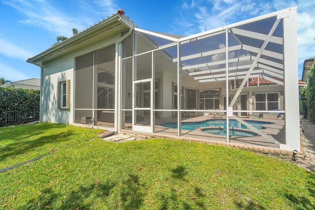5036 NW 24th Cir, Boca Raton, FL 33431 - back of property featuring a patio, stucco siding, glass enclosure, and a pool with connected hot tub