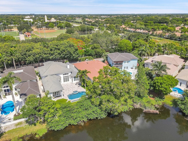 5036 NW 24th Cir, Boca Raton, FL 33431 - aerial perspective of suburban area with a pool area, a nearby body of water, and a tree filled landscape