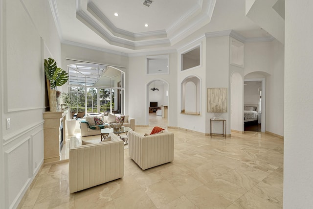 5036 NW 24th Cir, Boca Raton, FL 33431 - living area with arched walkways, ornamental molding, a towering ceiling, light marble finish floors, and a tray ceiling