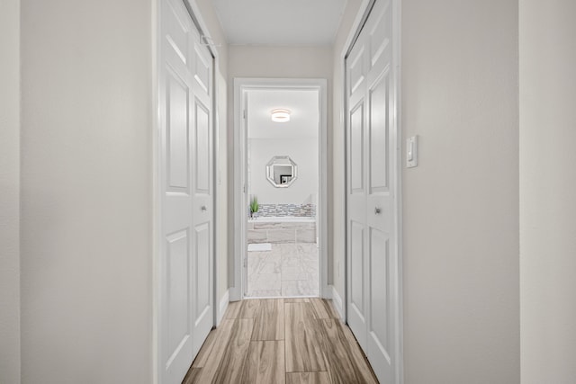 462 SW Sundance Trl, Port Saint Lucie, FL 34953 - corridor featuring light wood-type flooring and baseboards
