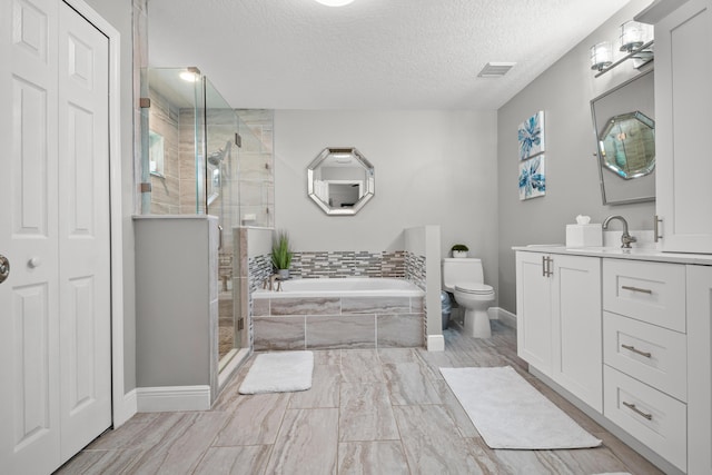 462 SW Sundance Trl, Port Saint Lucie, FL 34953 - full bath featuring a garden tub, vanity, a textured ceiling, a shower stall, and toilet