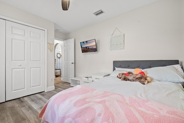 462 SW Sundance Trl, Port Saint Lucie, FL 34953 - bedroom with wood finished floors, a closet, baseboards, and ceiling fan