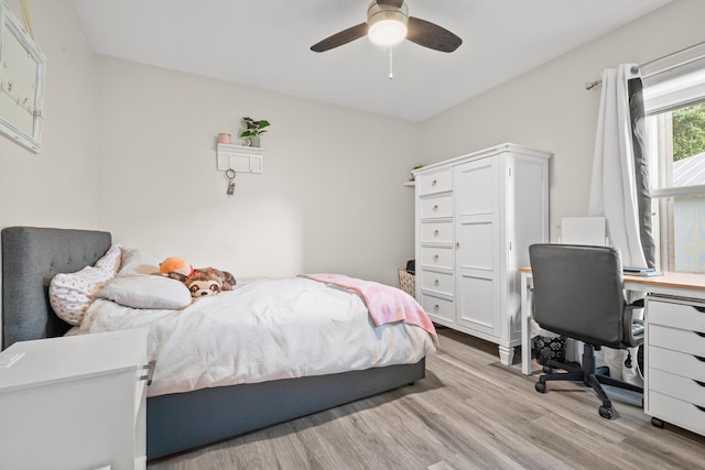 462 SW Sundance Trl, Port Saint Lucie, FL 34953 - bedroom with light wood-type flooring, an office area, and a ceiling fan