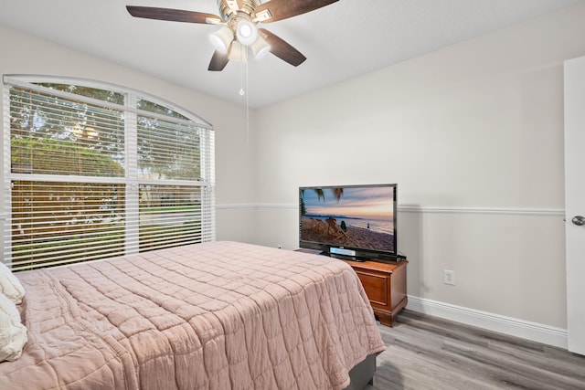 462 SW Sundance Trl, Port Saint Lucie, FL 34953 - bedroom with wood finished floors, baseboards, and ceiling fan