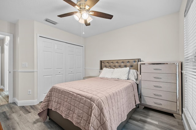 462 SW Sundance Trl, Port Saint Lucie, FL 34953 - bedroom with wood finished floors, a closet, baseboards, and ceiling fan
