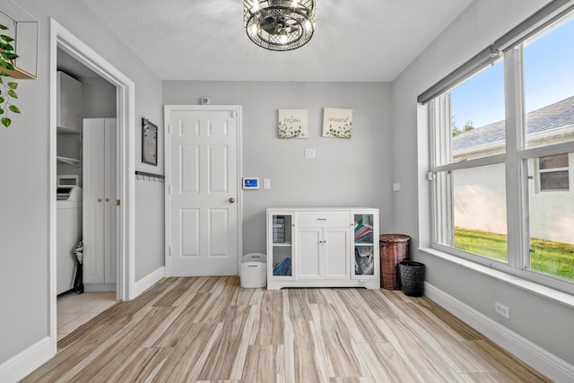 462 SW Sundance Trl, Port Saint Lucie, FL 34953 - dining area featuring plenty of natural light, light wood finished floors, and a chandelier