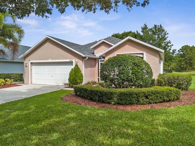 462 SW Sundance Trl, Port Saint Lucie, FL 34953 - view of front of property featuring an attached garage, driveway, stucco siding, and a front yard