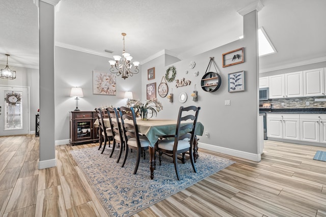 462 SW Sundance Trl, Port Saint Lucie, FL 34953 - dining space featuring a chandelier, ornamental molding, baseboards, light wood-style floors, and a textured ceiling