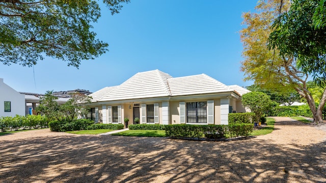 11354 Old Harbour Rd, North Palm Beach, FL 33408 - view of front of property featuring a tiled roof and stucco siding