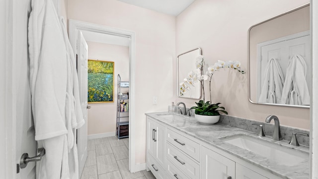11354 Old Harbour Rd, North Palm Beach, FL 33408 - full bath featuring double vanity and baseboards
