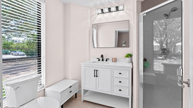 11354 Old Harbour Rd, North Palm Beach, FL 33408 - bathroom with toilet, vanity, a shower stall, and tile patterned flooring