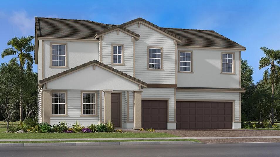 9311 Pearch Ln, Boynton Beach, FL 33437 - view of front facade featuring an attached garage, a tiled roof, and stucco siding