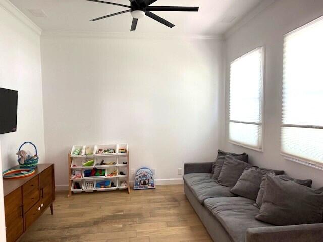3924 NW 58th St, Boca Raton, FL 33496 - living area featuring a ceiling fan, ornamental molding, light wood-style flooring, and baseboards