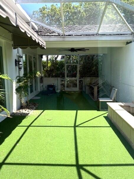 3924 NW 58th St, Boca Raton, FL 33496 - view of grassy yard featuring a patio