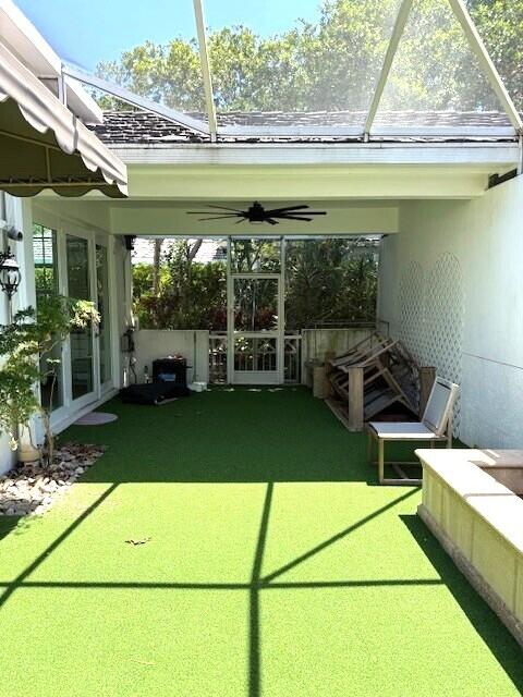 3924 NW 58th St, Boca Raton, FL 33496 - unfurnished sunroom with a ceiling fan