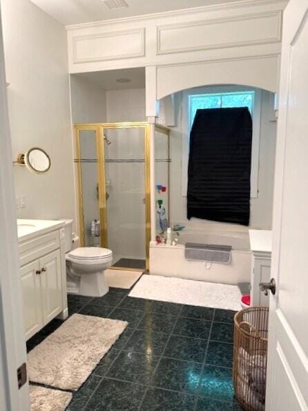 3924 NW 58th St, Boca Raton, FL 33496 - bathroom featuring vanity, a shower stall, a garden tub, toilet, and tile patterned floors