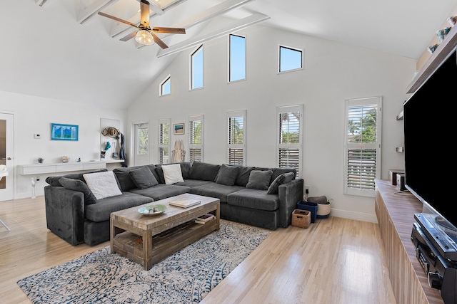 638 NE 8th Ave, Boynton Beach, FL 33435 - living room with a ceiling fan, high vaulted ceiling, wood finished floors, beam ceiling, and baseboards
