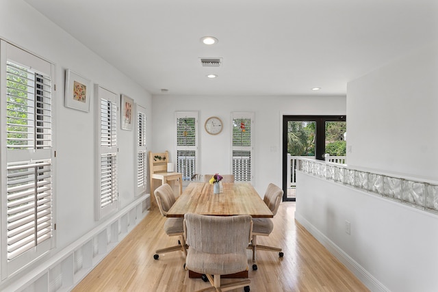 638 NE 8th Ave, Boynton Beach, FL 33435 - dining space featuring light wood-style flooring and recessed lighting