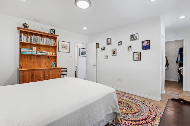638 NE 8th Ave, Boynton Beach, FL 33435 - bedroom featuring light wood-style flooring, recessed lighting, baseboards, and a spacious closet