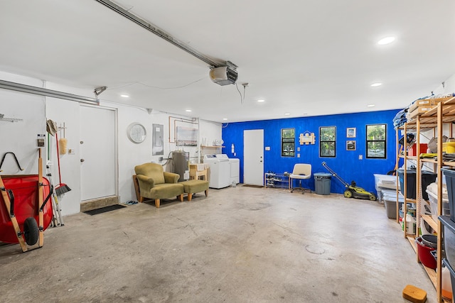 638 NE 8th Ave, Boynton Beach, FL 33435 - garage with electric panel, a garage door opener, recessed lighting, and separate washer and dryer