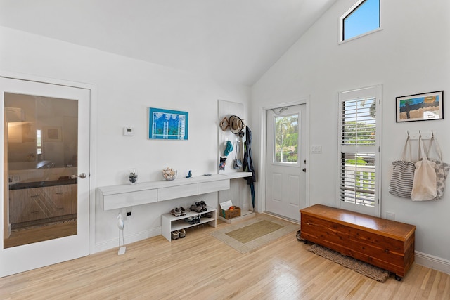 638 NE 8th Ave, Boynton Beach, FL 33435 - entrance foyer with wood finished floors, baseboards, and high vaulted ceiling