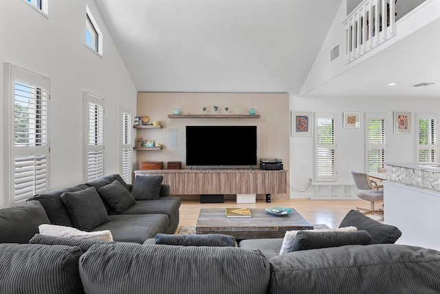 638 NE 8th Ave, Boynton Beach, FL 33435 - living room featuring high vaulted ceiling and light wood-style floors