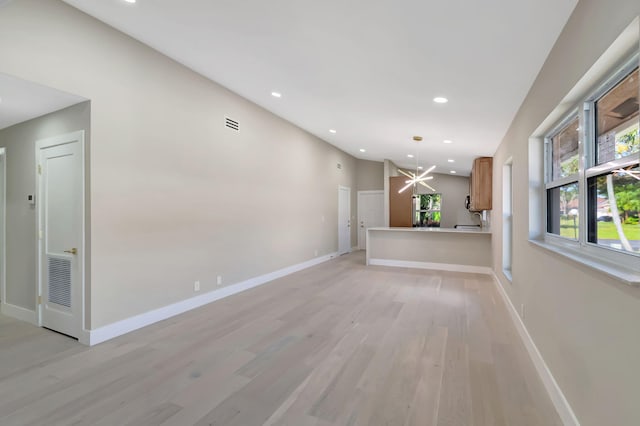 8164 Sweetbriar Way, Boca Raton, FL 33496 - unfurnished living room with light wood-style flooring, recessed lighting, baseboards, and a chandelier
