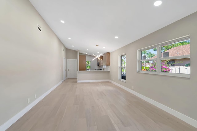 8164 Sweetbriar Way, Boca Raton, FL 33496 - unfurnished living room featuring recessed lighting, baseboards, light wood finished floors, and lofted ceiling