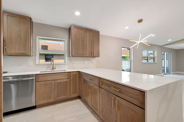 8164 Sweetbriar Way, Boca Raton, FL 33496 - kitchen with stainless steel dishwasher, a sink, a peninsula, recessed lighting, and light stone countertops
