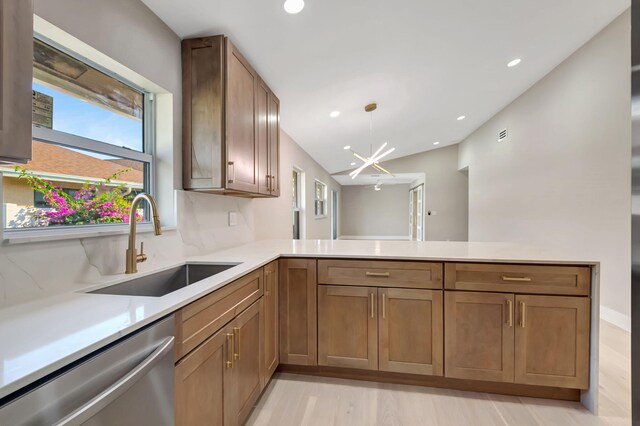 8164 Sweetbriar Way, Boca Raton, FL 33496 - kitchen featuring dishwasher, a sink, light countertops, light wood-style floors, and recessed lighting