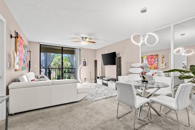 5100 Las Verdes Cir Unit 316, Delray Beach, FL 33484 - living room with carpet, a textured ceiling, and ceiling fan
