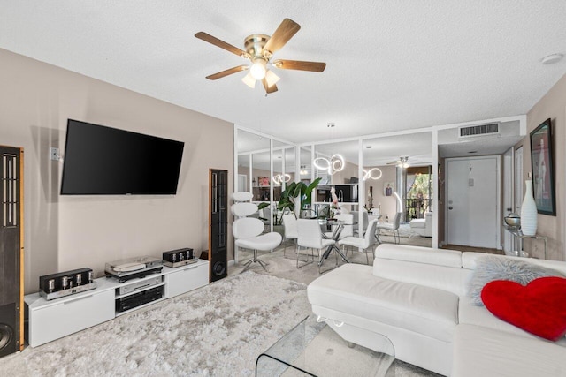 5100 Las Verdes Cir Unit 316, Delray Beach, FL 33484 - living room with a ceiling fan and a textured ceiling