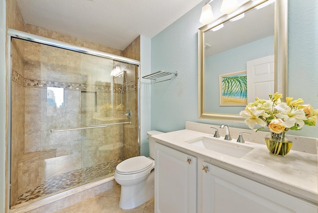370 Golfview Rd Unit 304, North Palm Beach, FL 33408 - full bath with toilet, vanity, a shower stall, and tile patterned flooring